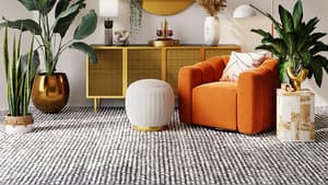 Wohnzimmer orangener Sessel und Kommode