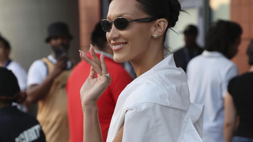 Bella Hadid Streetstyle trägt Sonnenbrille und weiße Bluse
