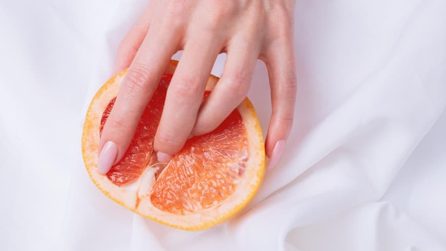 Weibliche Hand Orange